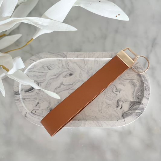 A selection of stylish faux leather keychains handmade in Nelson, New Zealand by Kiki & Co. Kiki & Co keychains are fabulous when you are busy and on the go. They fit easily over your wrist which is so good when your hands are full. They look super cute and never get lost in your handbag.