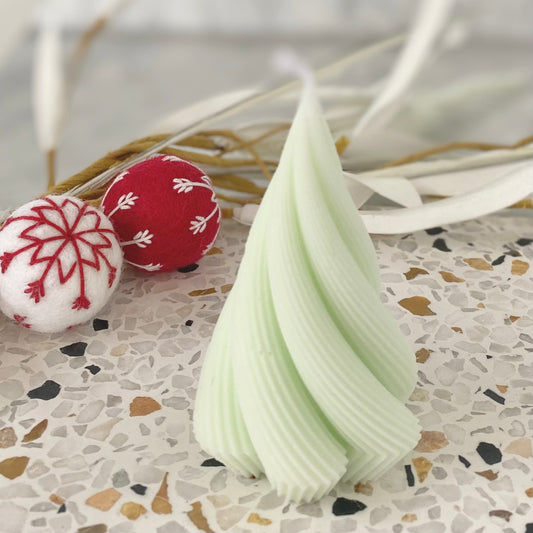 Gift Box NZ | New Zealand made products | Small gift boxes NZ | Gift in New Zealand   This festive hand poured Christmas tree shaped candle is handmade in Nelson, New Zealand by EM & ME Candles. This is a pine scented soy wax blend candle in a mint colour.