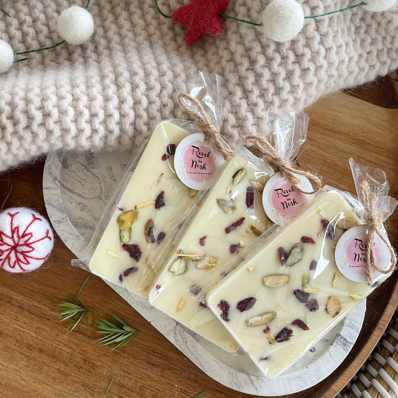 Indulge in our handcrafted cranberry & pistachio white chocolate bar from NZ. Perfect for a gift box NZ or a delicious treat!