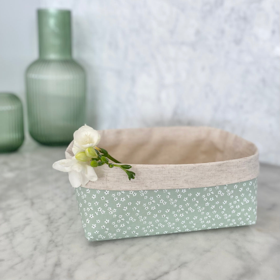 Gift Box NZ | New Zealand made products | Small gift boxes NZ | Gift in New Zealand |  A large size gift box jam packed with handmade products, all packaged in a pretty mint green petals fabric box. Leaf shaped trinket tray in white. Beeswax wraps in small, medium and large. Lemongrass and lime soap. 