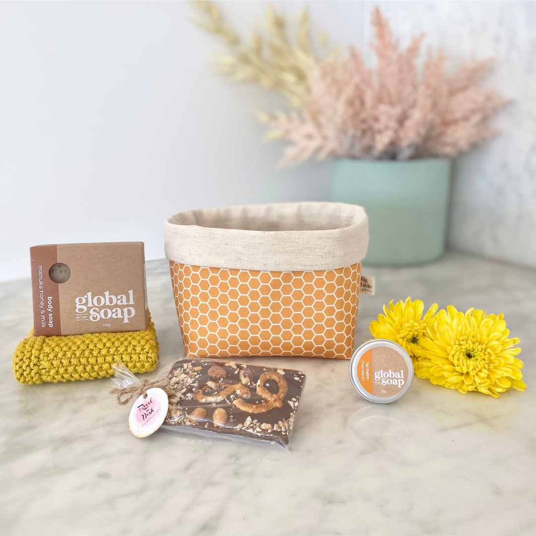 Gift Box NZ. This box is filled with honey inspired products in honeycomb design reusable fabric box.