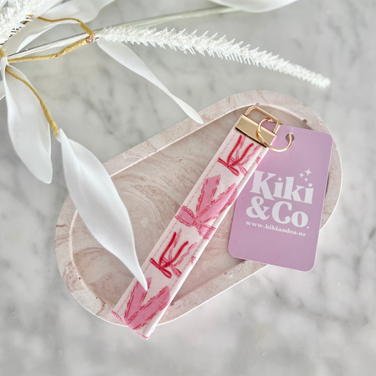 A cute as can be pink bow design chain, handmade in Nelson, New Zealand by Kiki & Co Kiki & Co keychains are fabulous when you are busy and on the go. They fit easily over your wrist which is so good when your hands are full. They look super cute and never get lost in your handbag. 