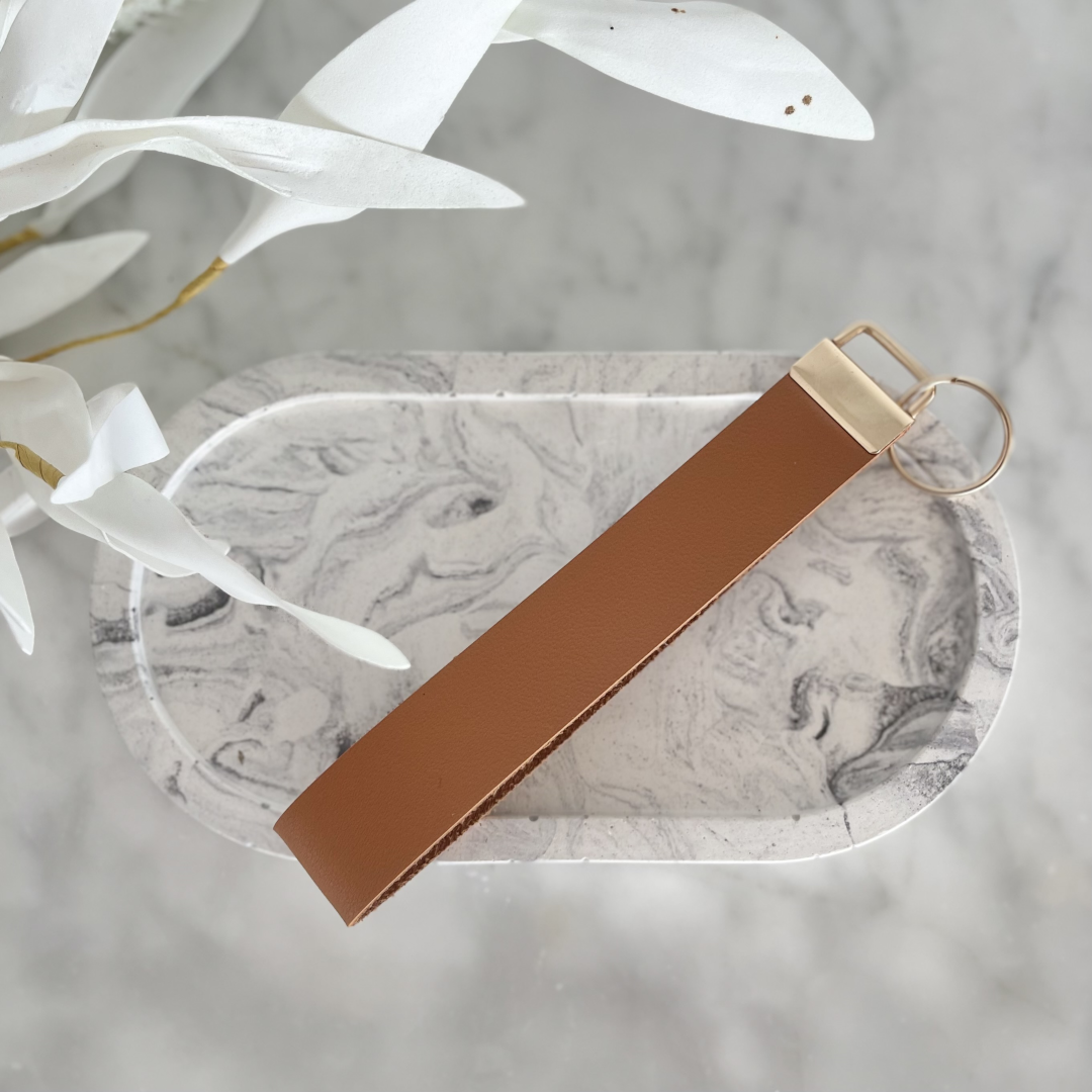 A selection of stylish faux leather keychains handmade in Nelson, New Zealand by Kiki & Co. Kiki & Co keychains are fabulous when you are busy and on the go. They fit easily over your wrist which is so good when your hands are full. They look super cute and never get lost in your handbag. 