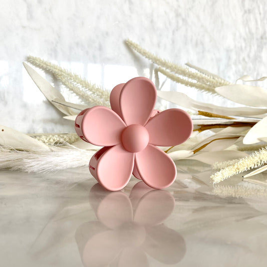 Gift Box NZ | New Zealand made products | Small gift boxes NZ | Gift in New Zealand | Daisy claw hair clip in dusky pink. Its unique design puts a modern spin on a classic floral look, while the sophisticated hue adds a touch of style to any outfit.