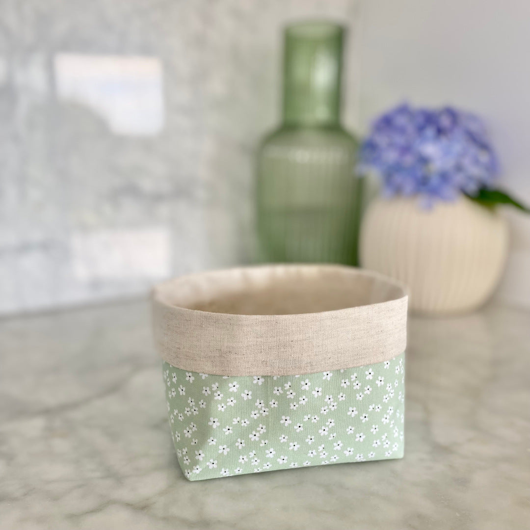 Gift Box NZ | New Zealand made products | Small gift boxes NZ | Gift in New Zealand  Gift box filled with garden inspired products. Gardening hand soap. Bug Balm. Mint daisy linen key chain. Natural knitted wash cloth. Sustainable reusable 100% cotton fabric gift box . NZ handcrafted. 