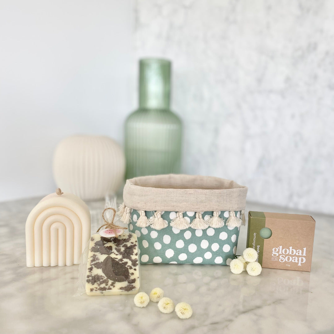 Gift Box NZ | New Zealand made products | Small gift boxes NZ | Gift in New Zealand |  White is classic colour paired with touches of teal green is make a stunning gift box collection. Snow white rainbow hand poured candle. Lemongrass & lime body soap. Cookie crumb white chocolate. Teal spotty tasseled fabric gift box
